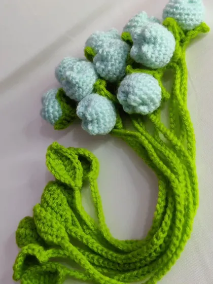 A bundle of light green tulip bookmarks.