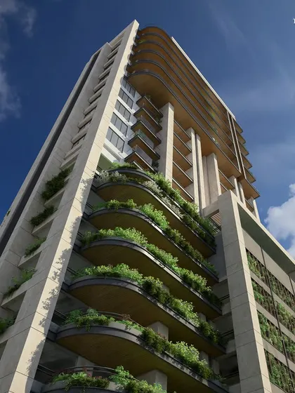 An upward view of the Bandra tower, showcasing the large, cascading balconies filled with greenery. This design enhances the natural flow of light and air, making each living space feel open and connected to the outdoors.