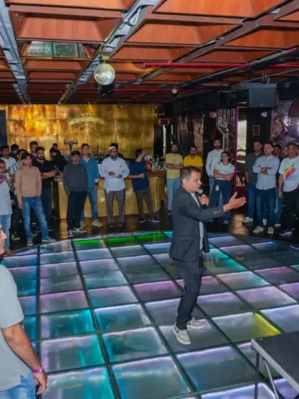 As your event host, my job is to keep the vibe electric from start to finish. Here I am getting the party started at a corporate offsite, making sure everyone feels involved and ready to have fun on the dance floor.