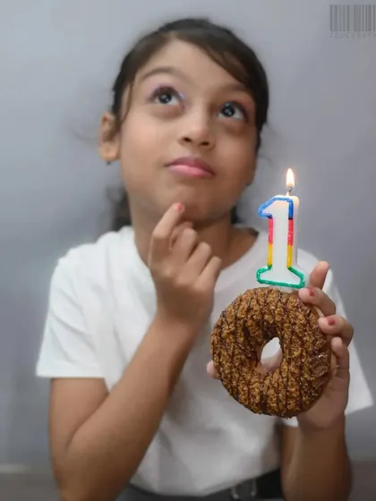 Another moment from the birthday shoot, capturing a thoughtful expression. I aim to provide a variety of shots, from playful to contemplative, to give a complete picture of a child's personality.