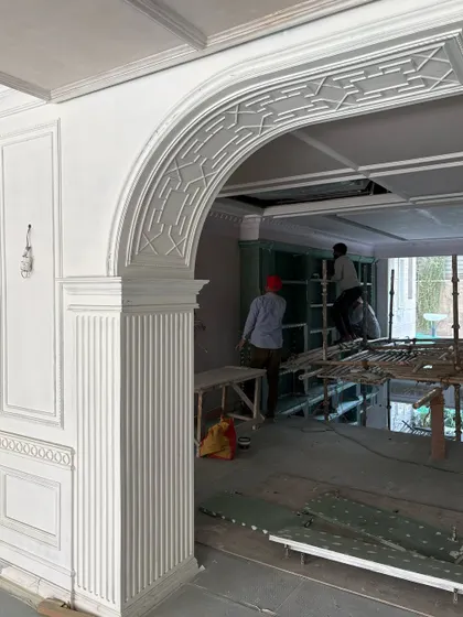 Work in progress at our Delhi site. Here, you can see the intricate plasterwork of an archway and fluted column being installed, a testament to the skilled craftsmanship that brings my designs to life.