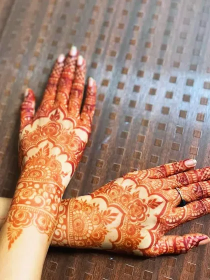 A stunning, bright reddish-orange henna stain, showcasing the beautiful color achieved with my organic paste.