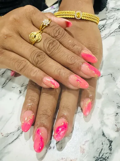 A beautiful pink marble or watercolor effect, with delicate gold foil flakes embedded in the design.