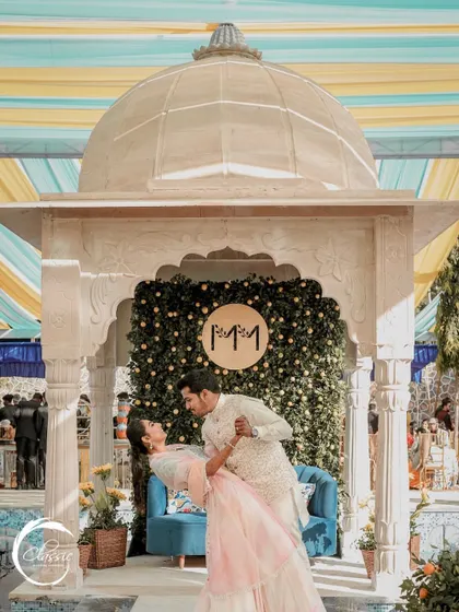 A joyful moment from a Rajasthani-themed Haldi. I created this setup with a marble-finish gazebo and a backdrop of greenery and lemons, providing a beautiful, picturesque spot for the couple's photos.