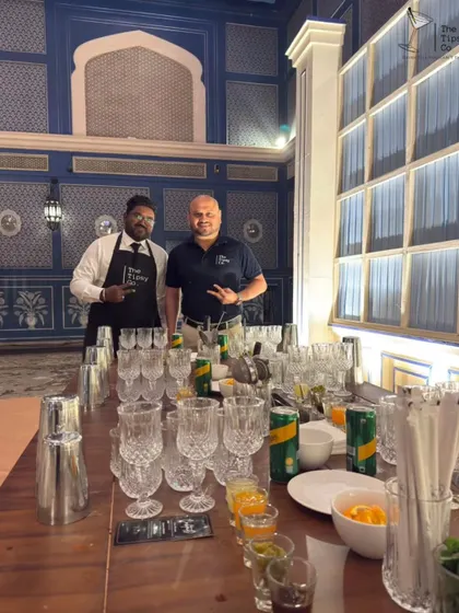 Our founder, Sid, leading a mocktail workshop at a wedding. This image shows the setup with all the necessary glassware, shakers, and fresh ingredients ready for the guests.
