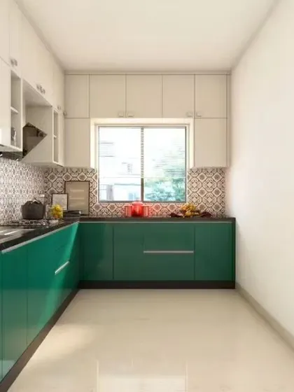 A compact L-shaped kitchen in a glossy green finish. The layout is designed to maximize counter space and storage in a narrow room.