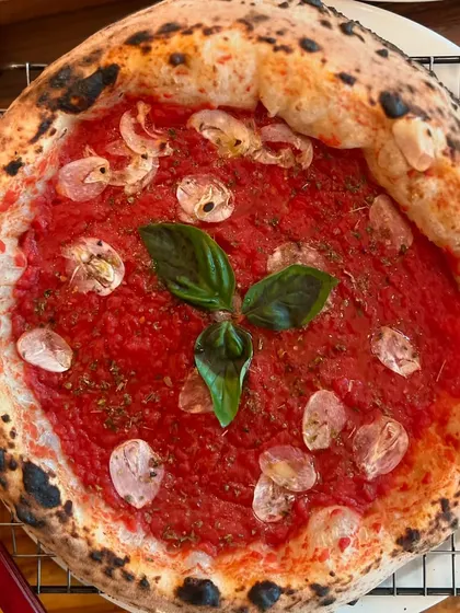 This Marinara pizza is a testament to our crust. Even with simple toppings, the quality of the dough shines through. Always crust-worthy.