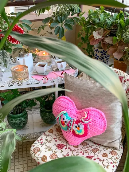 Another view of the owl heart cushion, peeking through the greenery. It’s a sweet little touch for a day of love.