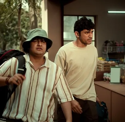 The two friends from the Nescafé commercial, styled in casual, comfortable clothes perfect for a summer road trip.
