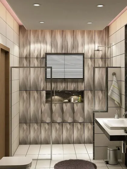 A bathroom featuring a unique 3D diamond-patterned wall tile, a glass shower enclosure, and a simple, functional vanity.