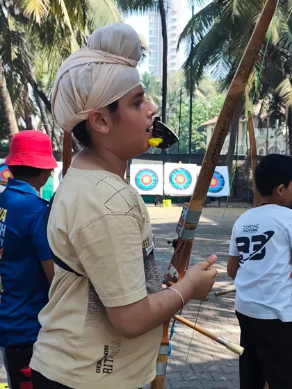 An archer waiting for his turn to shoot at the U-13 trials. Patience is a virtue that every archer learns to master.