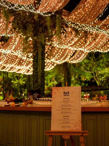 Another view of the festive bar, showcasing the custom bar menu and the magical ambiance created by the lighting.