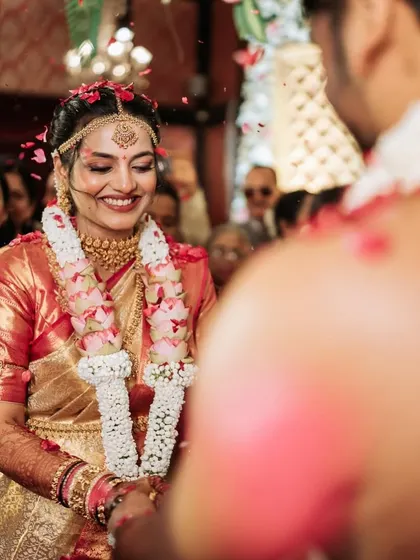 A candid moment from the wedding ceremony, with the bride's joyful expression captured perfectly.