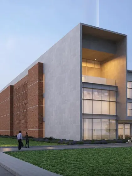 A rendering of the JSW Nagaur project in Rajasthan, where strategic massing and the use of local materials like brick respond to the hot and dry climate. The design embraces the raw character of materials to create a functional and comfortable space.