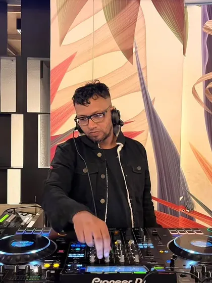 A focused look as I fine-tune the mix on my Pioneer DJ gear. Every detail matters when you're building a seamless musical journey.
