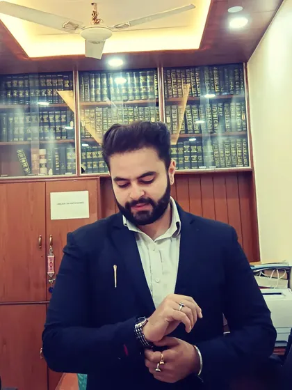 In my office, getting ready for the day. In this profession, time is money, and I make every second count for my clients.