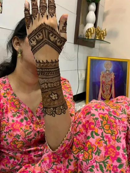 A lovely engagement mehndi design. This pattern is dense at the wrist and extends with a lighter touch towards the fingers, creating a balanced and beautiful look.