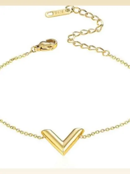 A minimalist bracelet with a simple V-shaped charm on a delicate chain. This piece is elegant, modern, and perfect for daily wear.