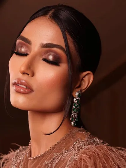 A dramatic smokey eye with a glossy finish. This editorial look is a great example of the advanced techniques you'll learn for your portfolio, focusing on texture and light.