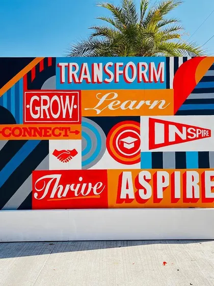 The other side of the large canvas for Manipal University, featuring a bold typographic design with motivational words like 'Transform', 'Grow', and 'Inspire'. This piece serves as a source of daily inspiration on campus.