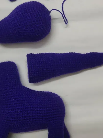 The making of a dragon. Here are the separate crochet pieces before they are assembled. This behind-the-scenes look shows how much work goes into each amigurumi toy.