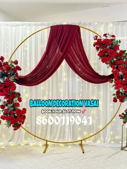 Make a statement with a bold color palette. This engagement setup uses a dramatic arrangement of red roses and matching fabric on a gold ring frame for a passionate, romantic feel.