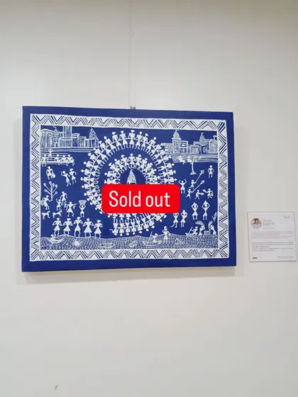 A closer look at the sold Warli masterpiece. The white figures on the deep blue background create a striking contrast, telling a story of celebration and togetherness.