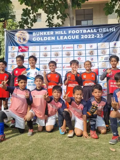 The victorious team posing for a photo after the Bunker Hill Golden League tournament. All smiles and victory signs.