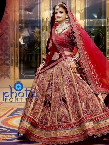 A beautiful album page dedicated to the bride, showcasing her full lehenga and a stunning portrait.