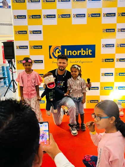 Posing for a photo with some of my youngest fans after a show at Inorbit Mall. It's all about creating a fun and welcoming experience for everyone.