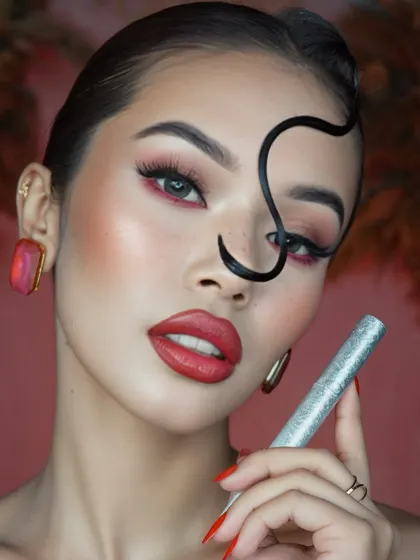 This shot highlights the mascara and the precision of the eye makeup, demonstrating our attention to every last detail.