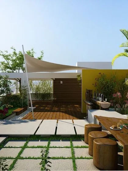 A design concept for a penthouse terrace in Marathahalli, featuring a dining area, a water feature, and a tensile fabric shade structure for a modern and functional outdoor space.
