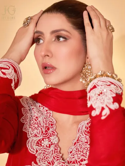 Radiant as ever. This crimson creation is beautifully adorned with our exquisite Polki diamond jewellery, including statement rings and a handcrafted bracelet, blending tradition with high fashion.