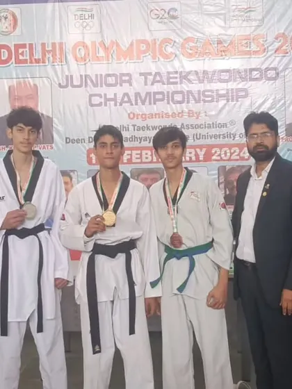 A group of our junior medalists at the Delhi Olympic Games. Their success is a reflection of their dedication to training.