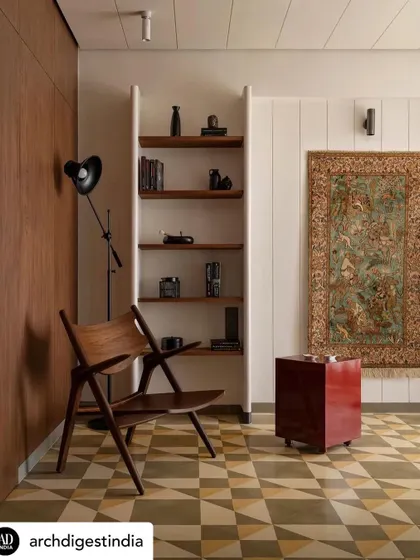 The study in Apartment 1005, where we used traditional materials in a minimal and clean way. The space features cement tiles, a custom bookshelf, and a classic Pierre Jeanneret chair, creating an enclave that is both Indian and timeless.