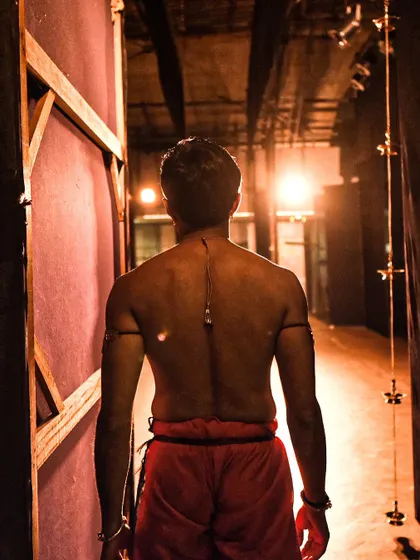 A backstage shot just before going on for a solo performance. This is a moment of focus and preparation before stepping into the light.