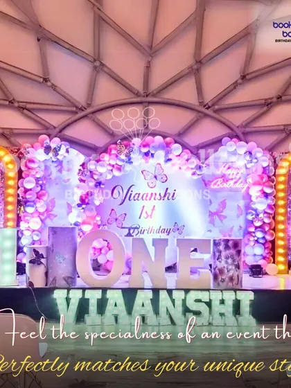 This butterfly themed first birthday for Viaanshi was designed to match her unique style. The elegant stage setup with marquee letters and beautiful balloon art made for an exceptional experience.
