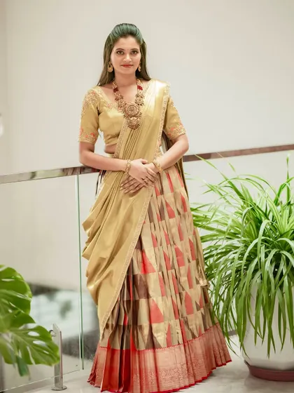 A three-quarter shot of the client in her custom half saree, a testament to my global design process.