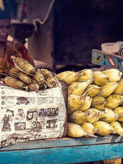 A documentary-style shot of a corn seller at her street cart in Hampi. I was drawn to the colors, the textures, and the quiet routine of her work. This kind of candid street photography is about observing and capturing the beauty in everyday life.