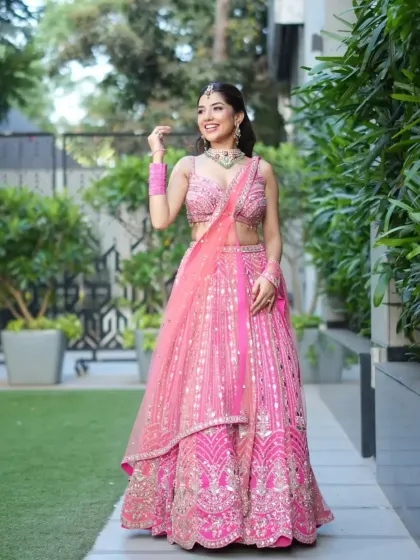 Another beautiful shot of the pink lehenga, showcasing its movement and elegance in an outdoor setting. Ideal for your pre-wedding or sangeet photoshoot.