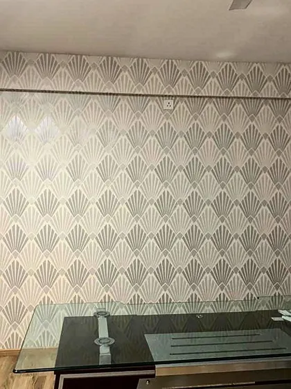An art deco inspired fan pattern wallpaper used in an office space. The geometric design adds a touch of vintage glamour and sophistication.