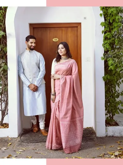 A modern take on tradition, as seen in The Wedding Affair. This couple is styled in a soft pink saree and a complementary light blue silk kurta with a matching jacket, perfect for a daytime wedding event.