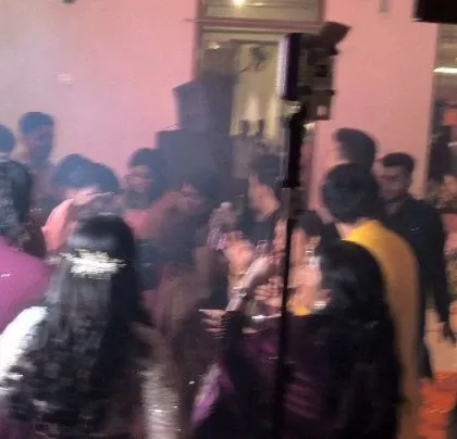 The dance floor is packed at this lively Tamil wedding.