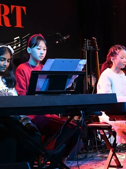 A four-person keyboard ensemble showcasing their coordinated skills. We arrange music specifically for our student groups to learn and perform.