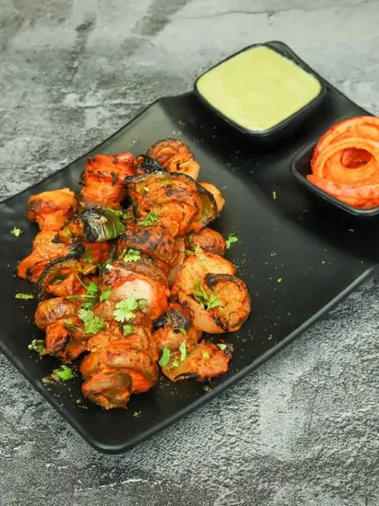 Another look at our Tandoori Mushroom Tikka, served with fresh mint chutney and pickled onions. A healthy and delicious vegetarian appetizer.