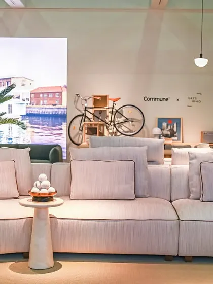 The Montserrat Sofa in a bright, open showroom setting. Its clean, contemporary lines and neutral upholstery make it a perfect canvas for any interior design style, from minimalist to eclectic.