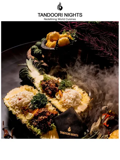 A dramatic presentation of our pineapple-based tandoori dishes. The smoky effect adds a theatrical element, making the serving of the food an experience in itself.