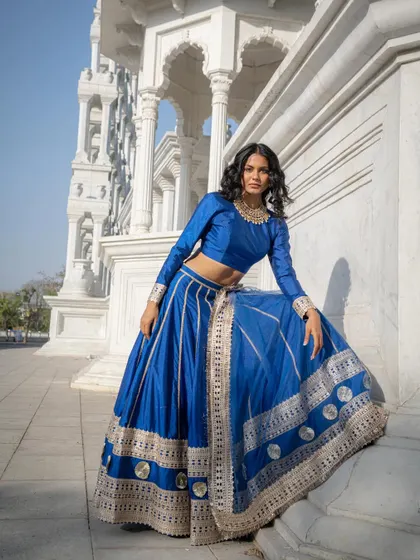 Another look at our royal blue silk lehenga, inspired by the grand costumes of period dramas. It's simply gorgeous.