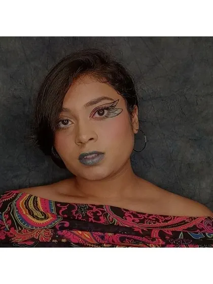 A clear, straight-on shot of the butterfly wing makeup. This view provides a full look at the symmetry and placement of the graphic liner.