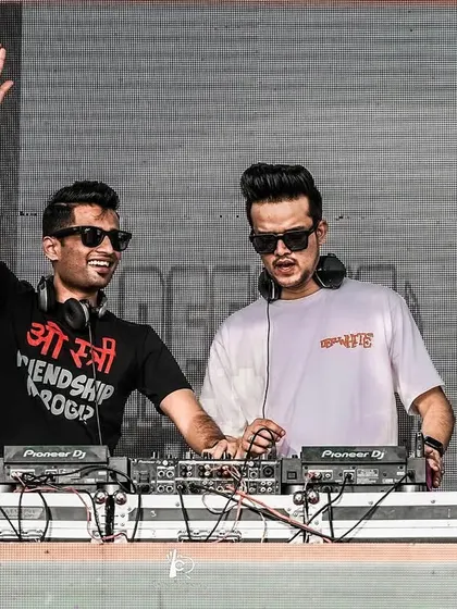 Waving to the crowd during a B2B set. We feed off each other's energy to create a dynamic performance that keeps the audience engaged.